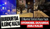 Burdur'da İlginç Kaza: Otomobil Bahçe Duvarında Asılı Kaldı